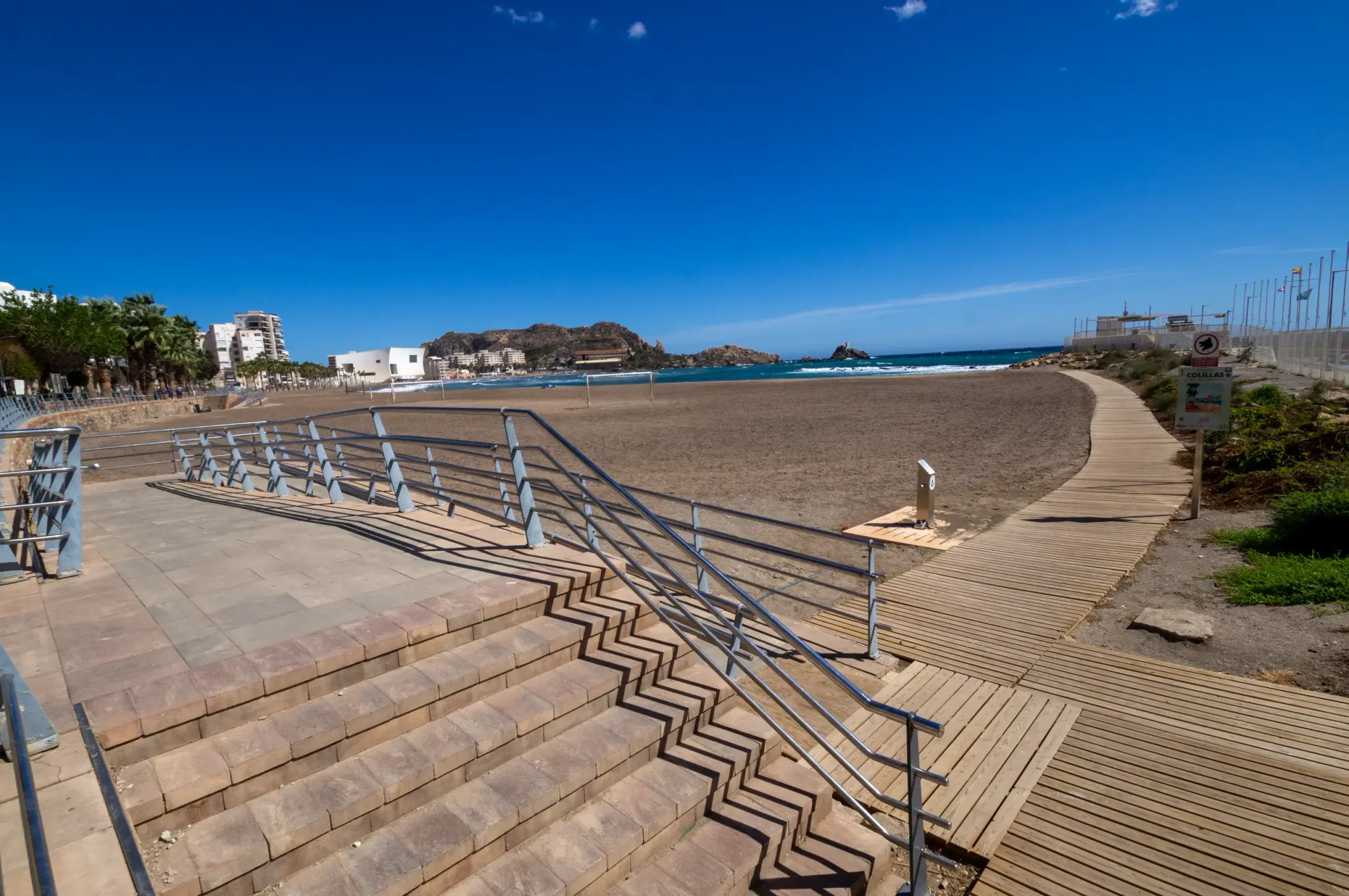 Steps and promenade beside a sandy beach in Águilas
