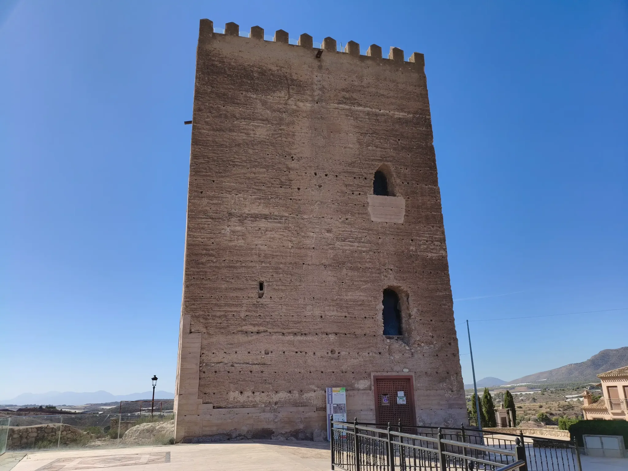 Entrance and stone facade of the Torre del Homenaje in Aledo
