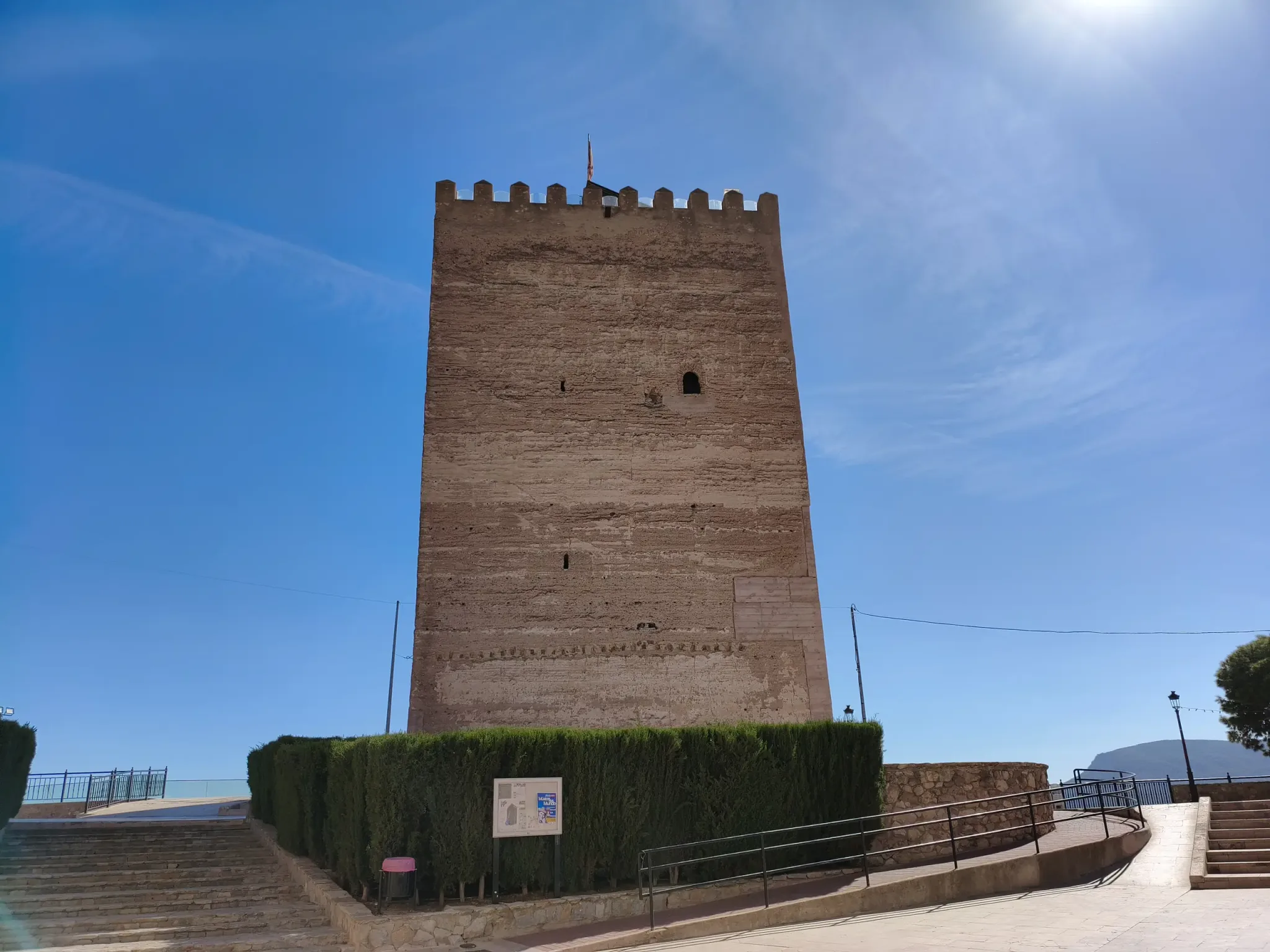 Medieval keep of Aledo Castle beneath a clear blue sky