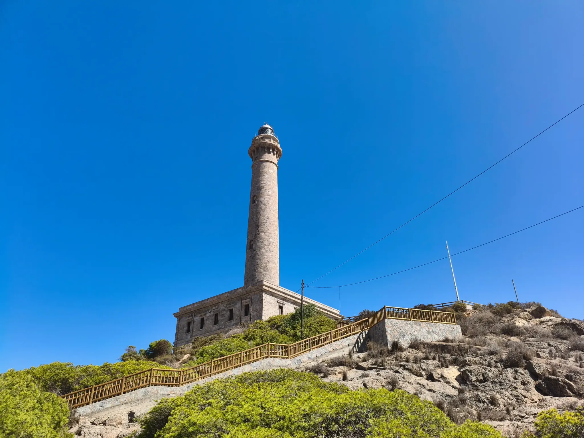 Cabo de Palos Lighthouse above the rocky Mediterranean headland
