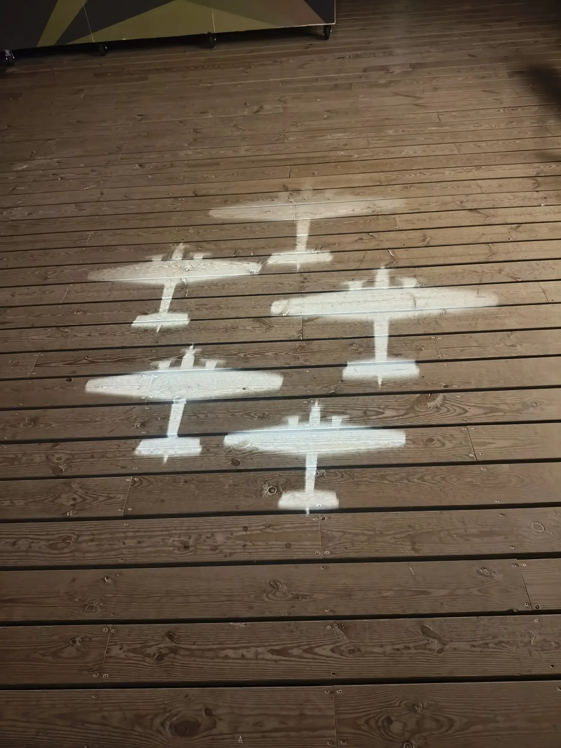 Aircraft silhouettes marked along the floor of a museum gallery