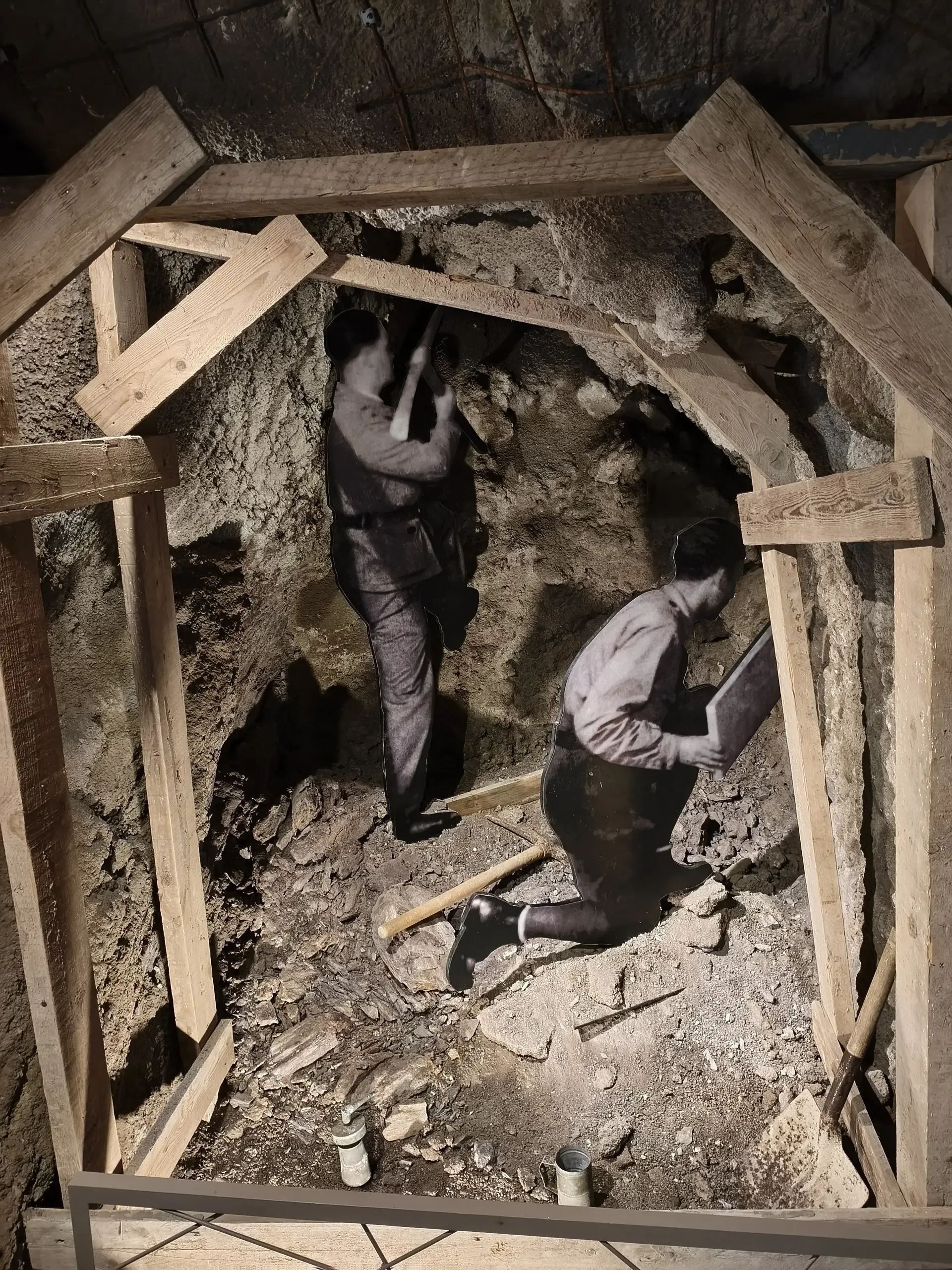 Museum reconstruction showing workers excavating a shelter