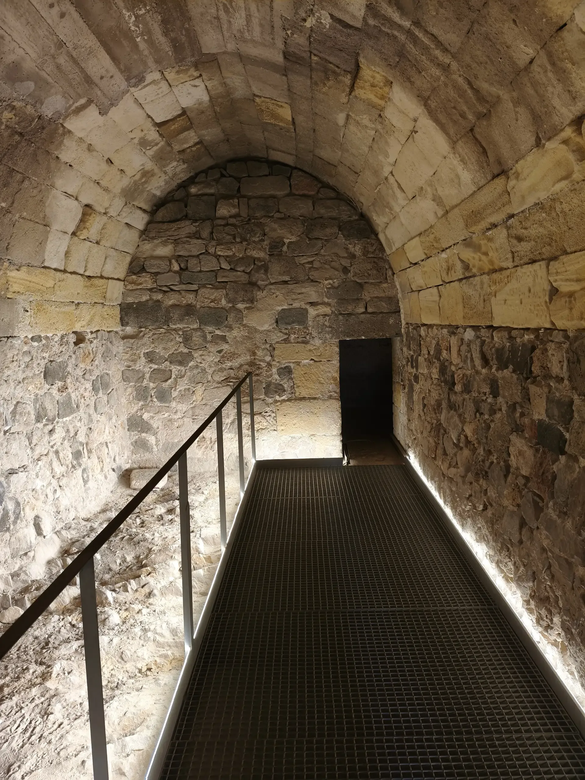 Illuminated arched passage inside the castle