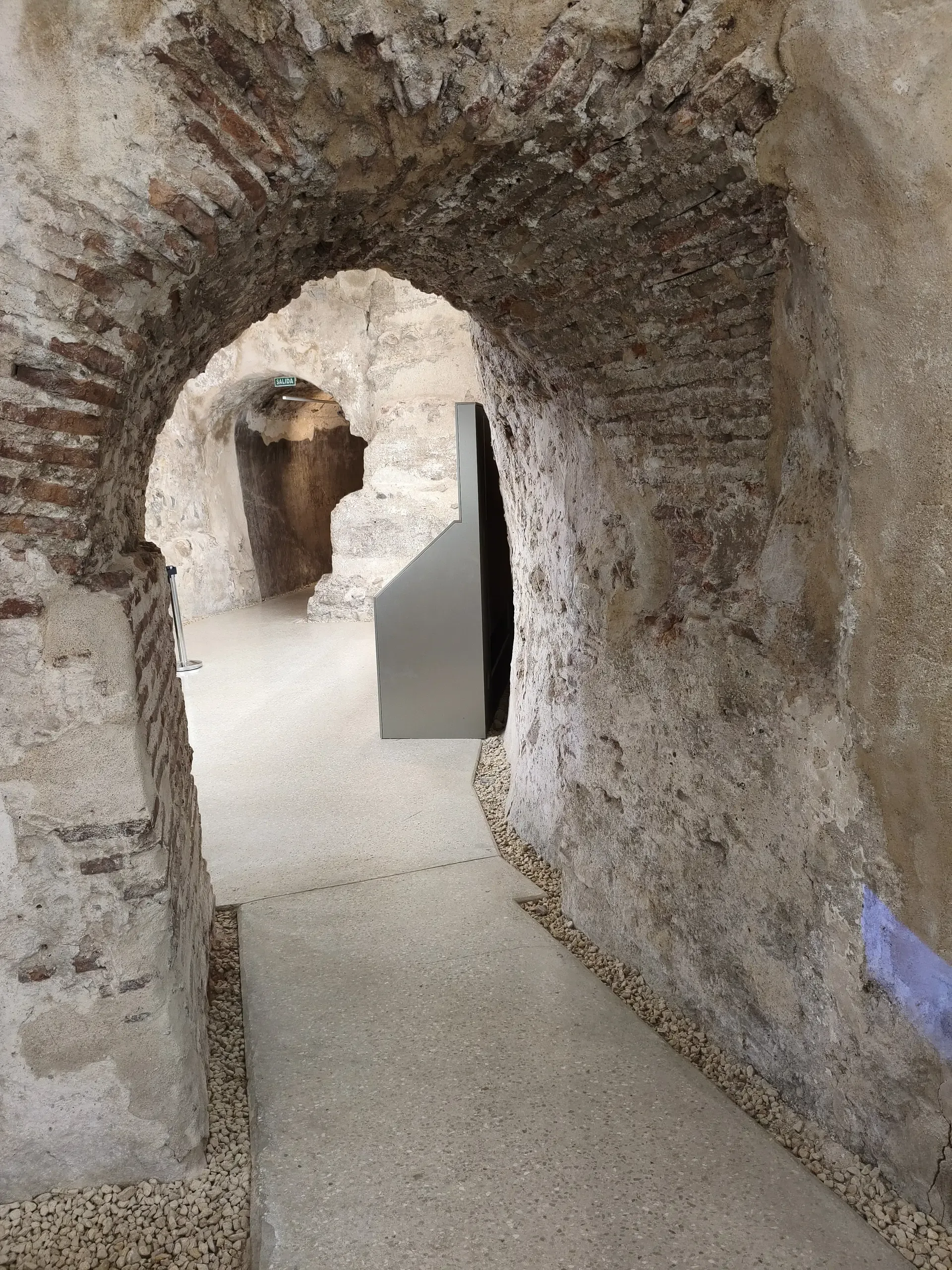 Stone archway connecting rooms inside Concepción Castle