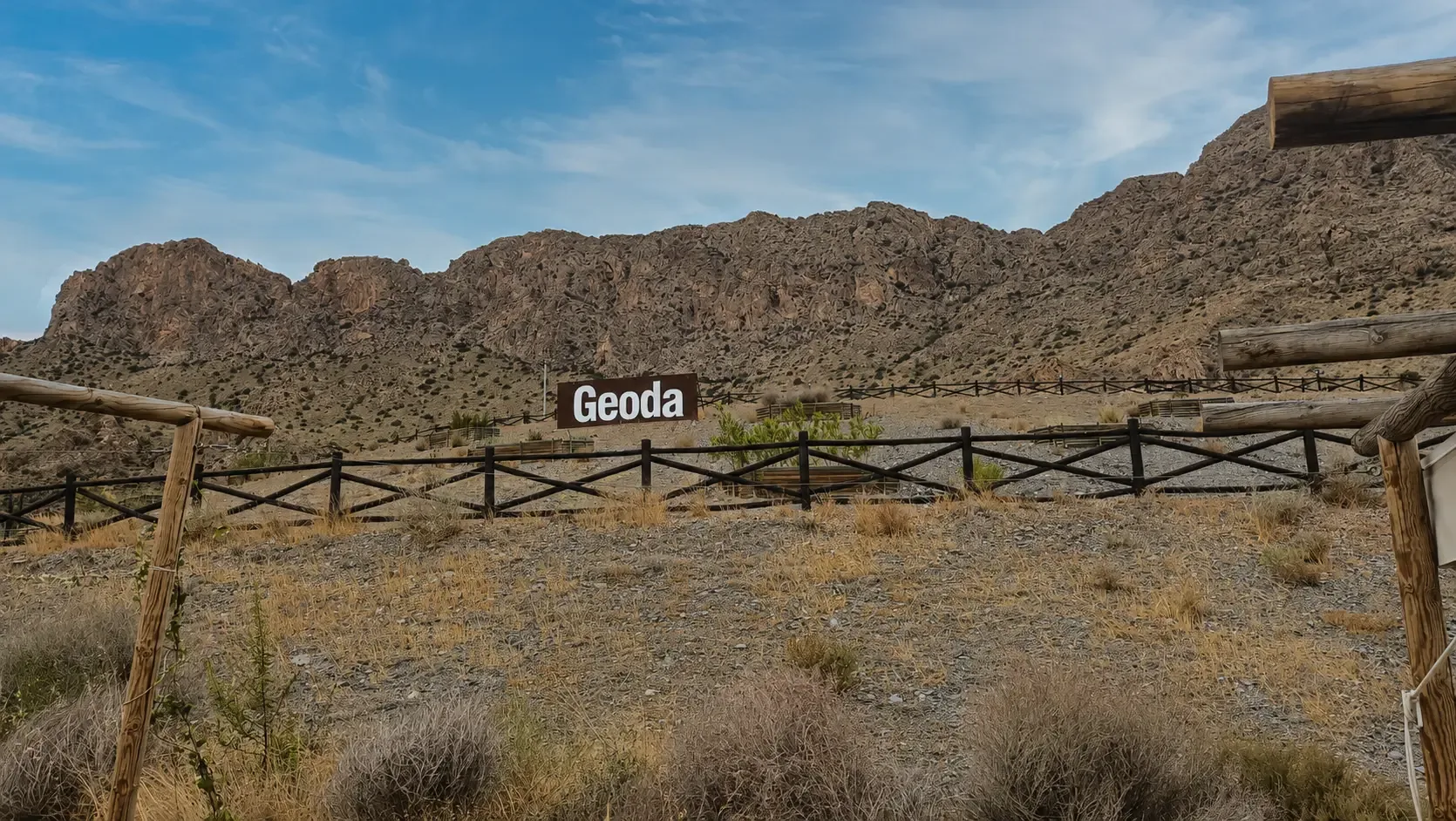 Geoda visitor-site sign beneath the Sierra del Aguilón