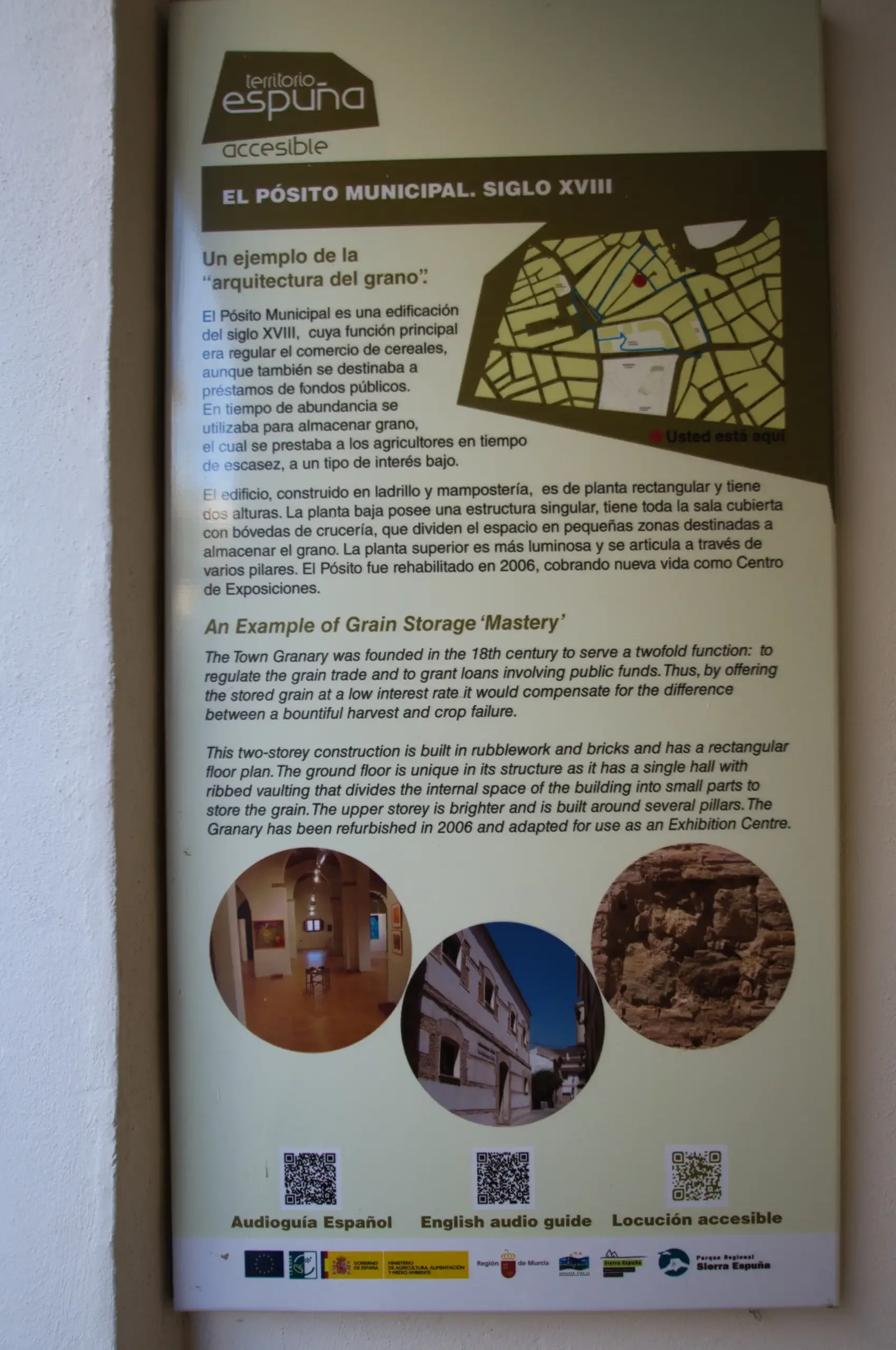 Bilingual interpretation panel explaining the history and layout of El Pósito Municipal