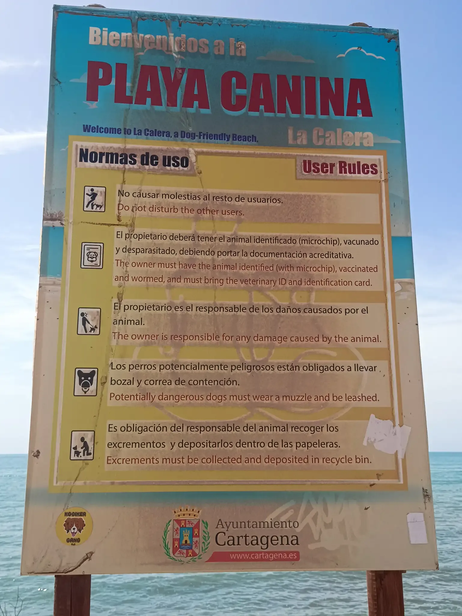 Welcome and rules sign for La Calera dog-friendly beach