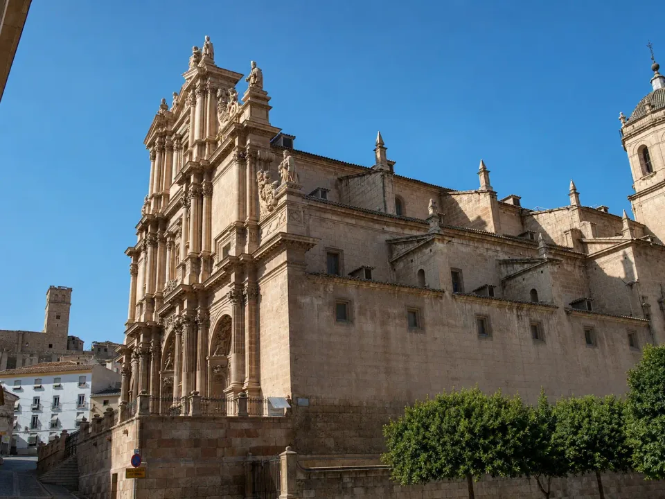 Ornate stone church in Lorca's historic centre beneath a clear blue sky
