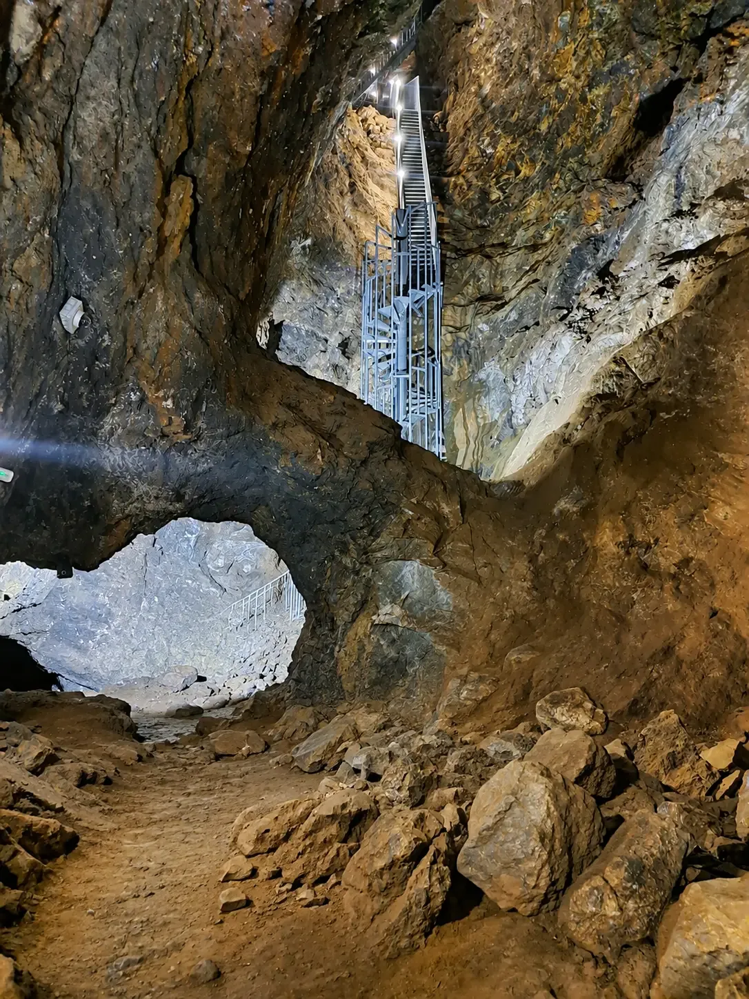 Rocky underground gallery and metal stairs inside Mina Rica