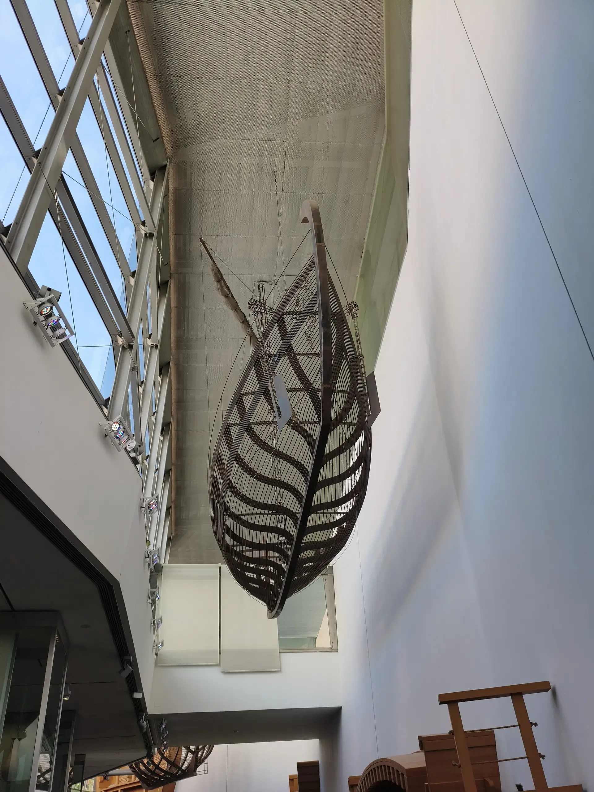 Suspended wooden boat frame inside the museum