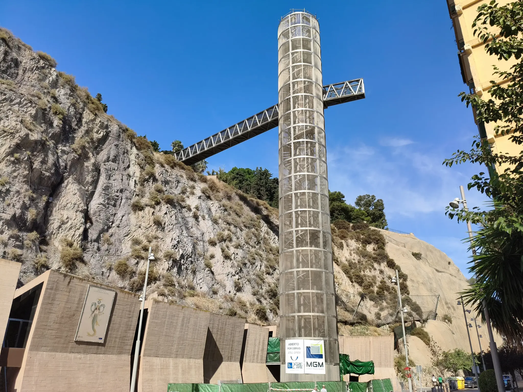 Tall glass panoramic lift tower rising beside Concepción Hill in Cartagena