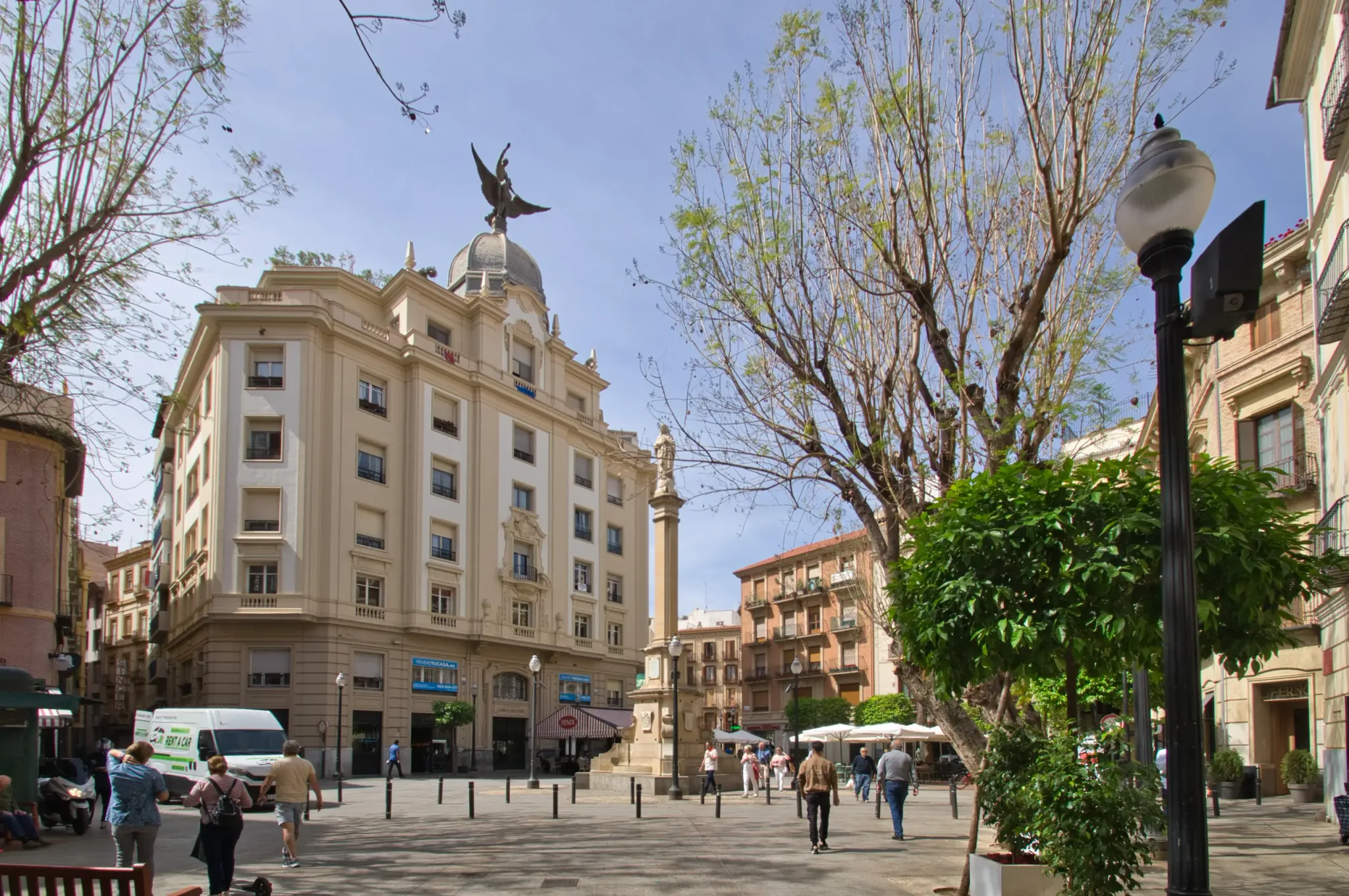 Buildings, cafes and flower displays around Plaza de las Flores in Murcia, view 2