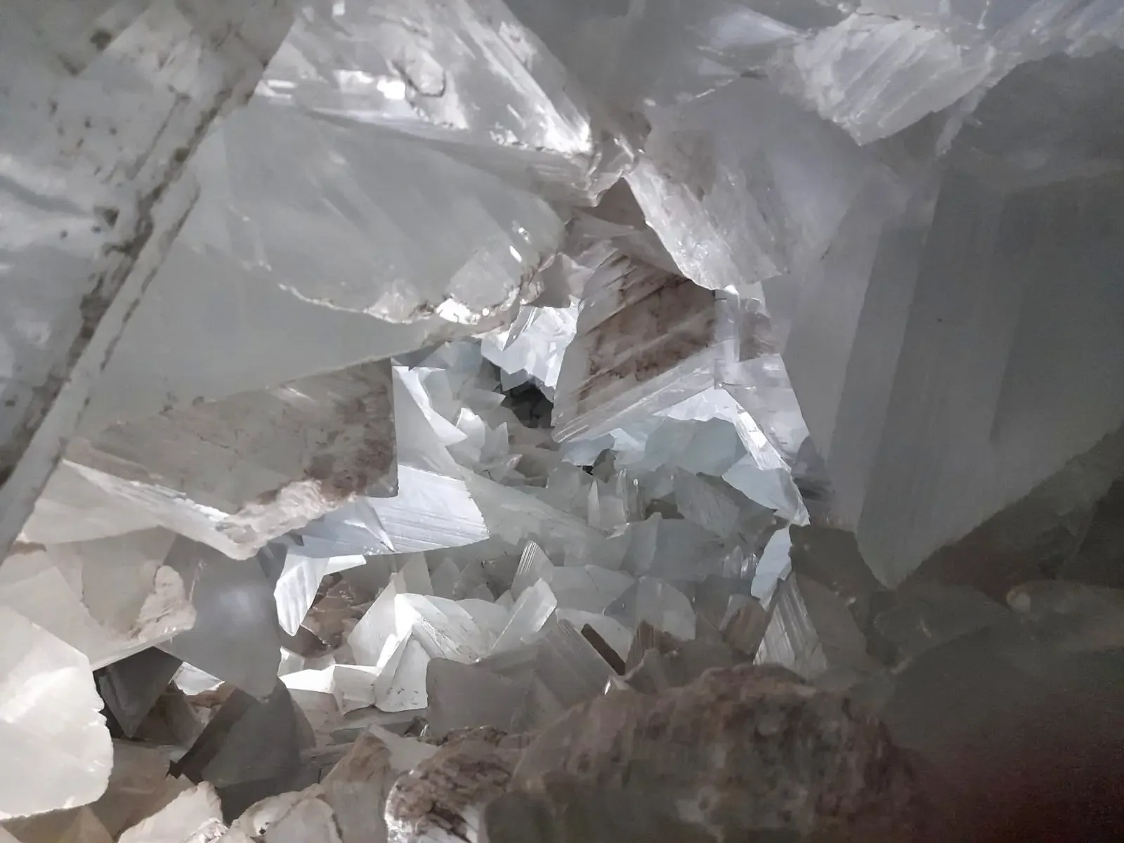 Overlapping translucent gypsum crystals inside the Pulpí Geode
